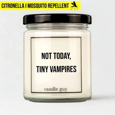 Citronella candle with the quote “Not today, tiny vampires” in a white jar with black lid – studio shot