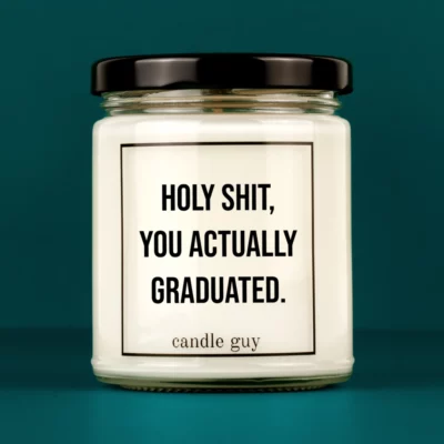 Discover our bestselling quote candle: "Holy Shit, you actually graduated." – handcrafted with love and 100% soy wax. A true original by candle guy.