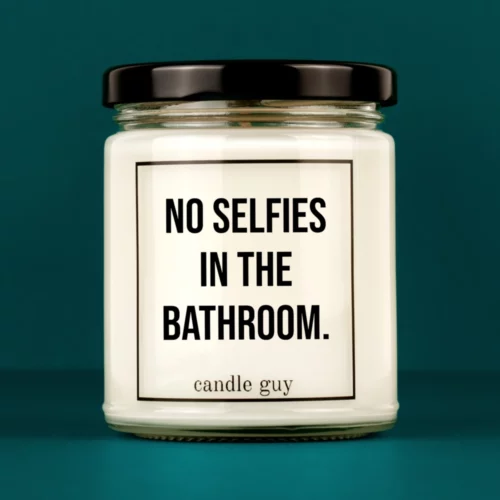 Discover our bestselling quote candle: "No selfies in the bathroom." – handcrafted with love and 100% soy wax. A true original by candle guy.