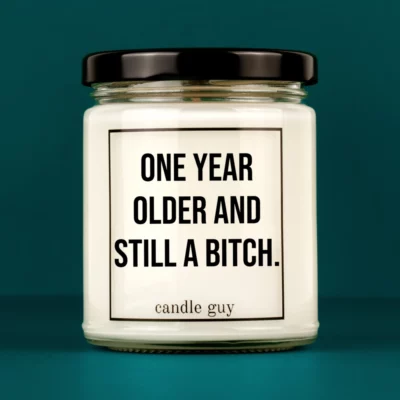Discover our bestselling quote candle: "One year older and still a bitch." – handcrafted with love and 100% soy wax. A true original by candle guy.