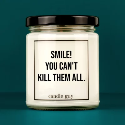 Discover our bestselling quote candle: "Smile! You can't kill them all." – handcrafted with love and 100% soy wax. A true original by candle guy.