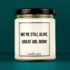 Discover our bestselling quote candle: "We're still alive - great job, mom!" – handcrafted with love and 100% soy wax. A true original by candle guy.